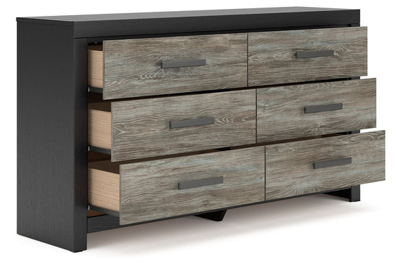 Black dresser with gray woodgrain drawers, one drawer partially open, metal bar pulls