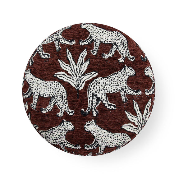 Round animal-print ottoman top in brown and cream with zebra and palm-leaf pattern