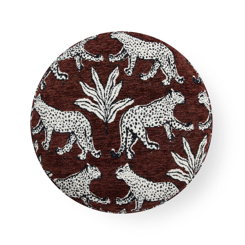 Round animal-print ottoman top in brown and cream with zebra and palm-leaf pattern