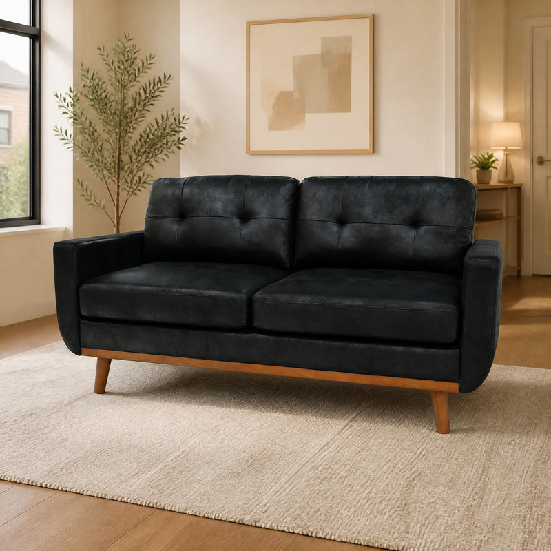 Two-seat sofa in black upholstery with button-tufted back and wooden legs