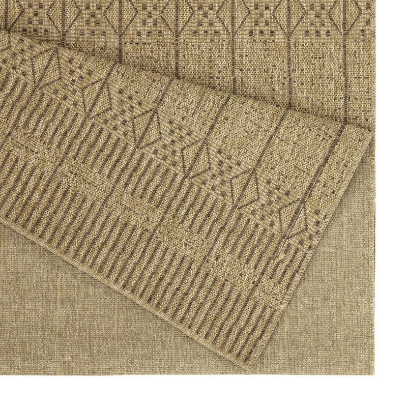Close-up of light brown area rug corner with woven texture and diamond geometric pattern.