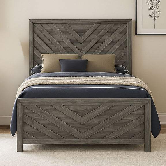 Dark gray chevron bed with tan and navy pillows and black-and-cream comforter