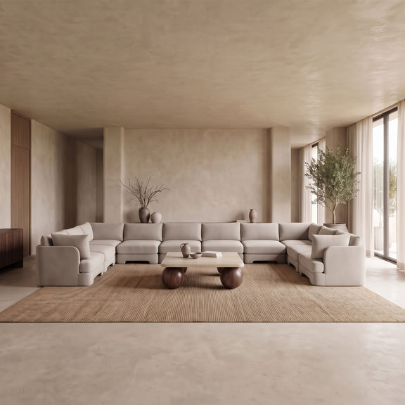 Light beige velvet performance sectional sofa with plush seat cushions and arms.