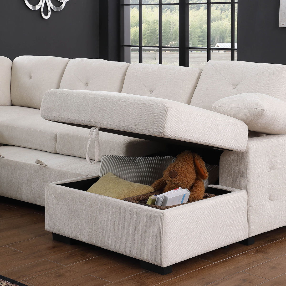 Light gray sectional sofa with chaise storage compartment open on the seat