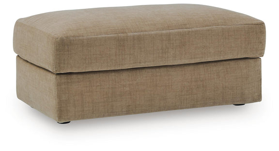 Honey beige fabric upholstered ottoman with hinged lid and short block legs