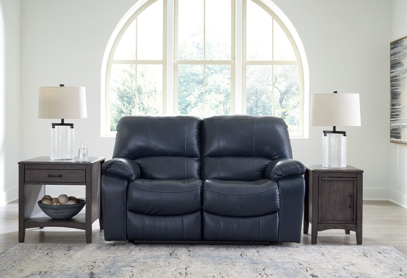 Dark navy power reclining loveseat with two-seat back and plush arm bolsters