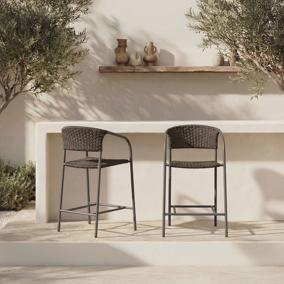 Set of two outdoor counter chairs with dark woven seats and backs, black metal frames