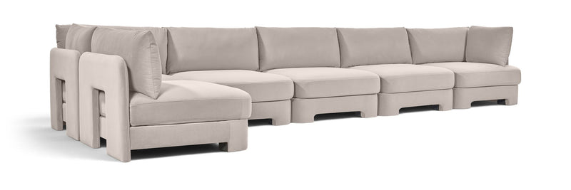 Light gray L-shaped armless sectional sofa with velvet-style upholstery and deep seat cushions