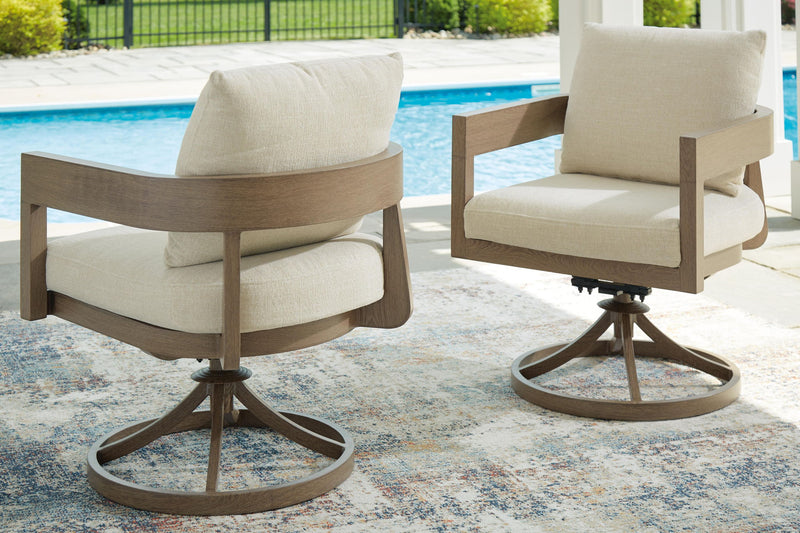 Swivel patio chair with beige cushion on dark brown circular pedestal base