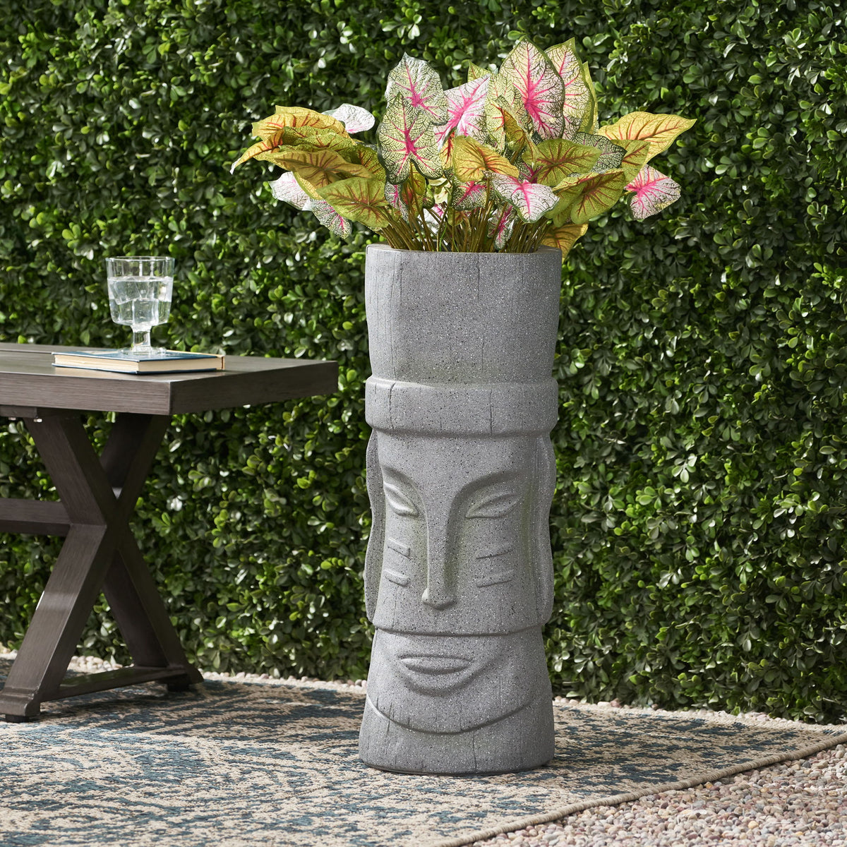 Stone gray vertical relief planter with round opening at the top