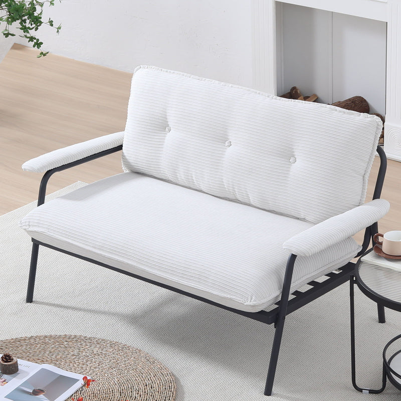 White striped loveseat sofa with padded backrest and seat on black metal legs