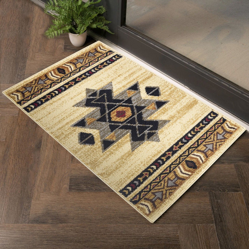 Beige southwest area rug with central star motif and dark arrow band borders