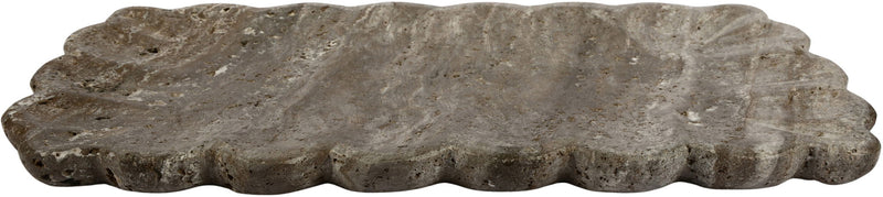 Gray travertine tray with scalloped edges and mottled stone surface