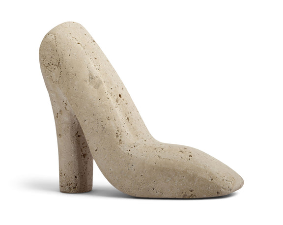 Beige travertine-style high-heel shoe tabletop sculpture with speckled texture