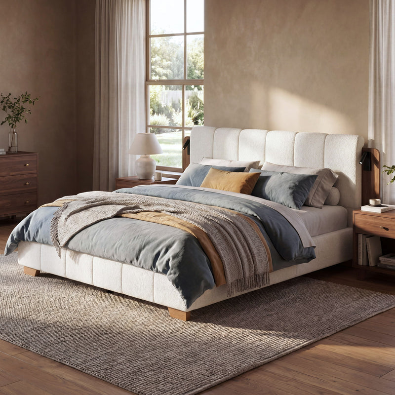 White upholstered platform bed with tall headboard and side reading light panels