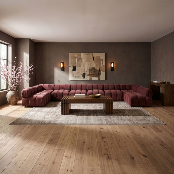 Dark red modular sectional sofa with tufted cushions and curved modular layout