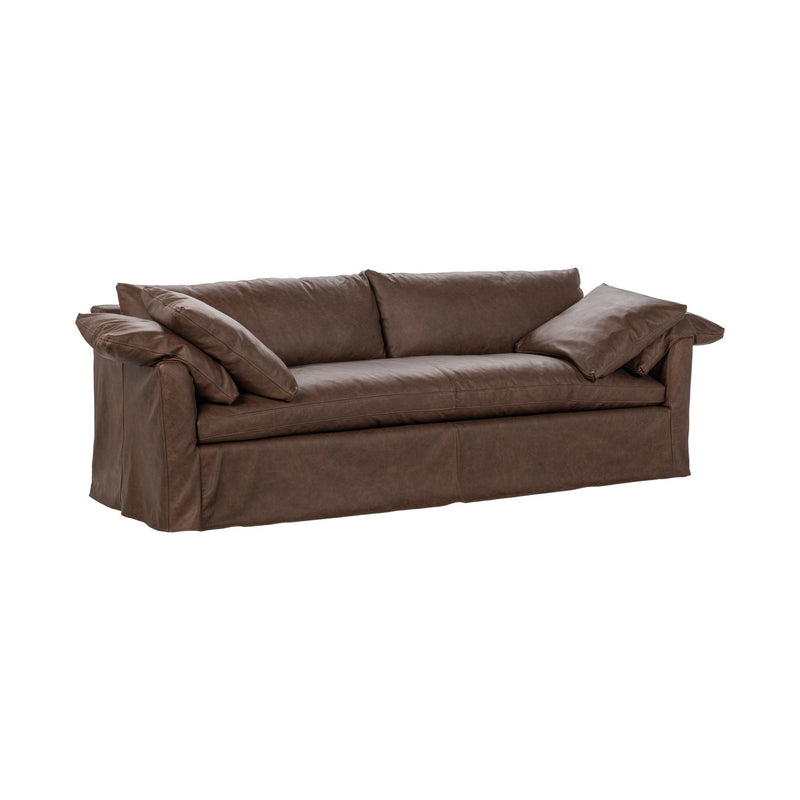 Sofa slip cover in dark brown fabric with draped arms and layered cushions