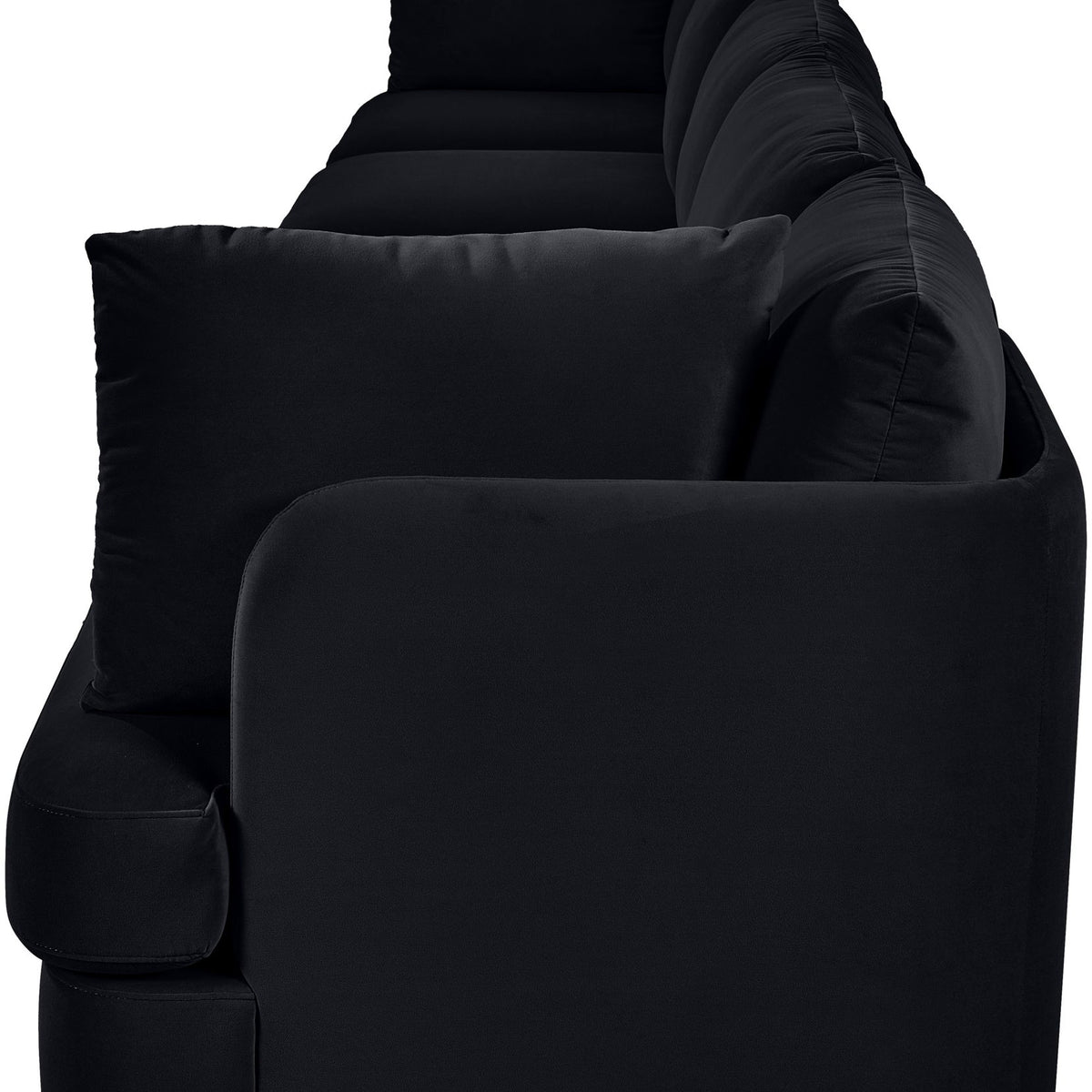 Black velvet upholstered sofa armchair with rounded arms and thick seat cushions