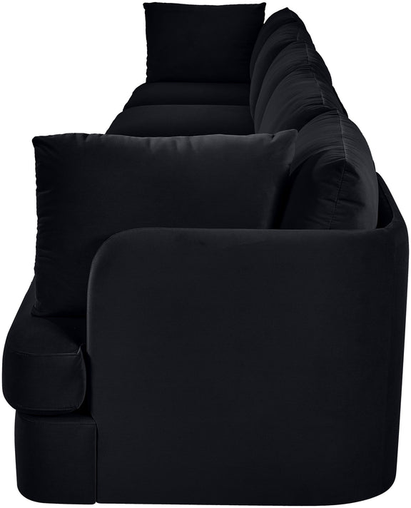 Black velvet upholstered sofa armchair with rounded arms and thick seat cushions
