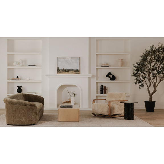 Cream shag lounge chair with curved back and wooden armrests