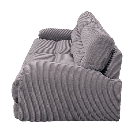 Gray corduroy sofa seat and arm with textured fabric and supportive back cushions