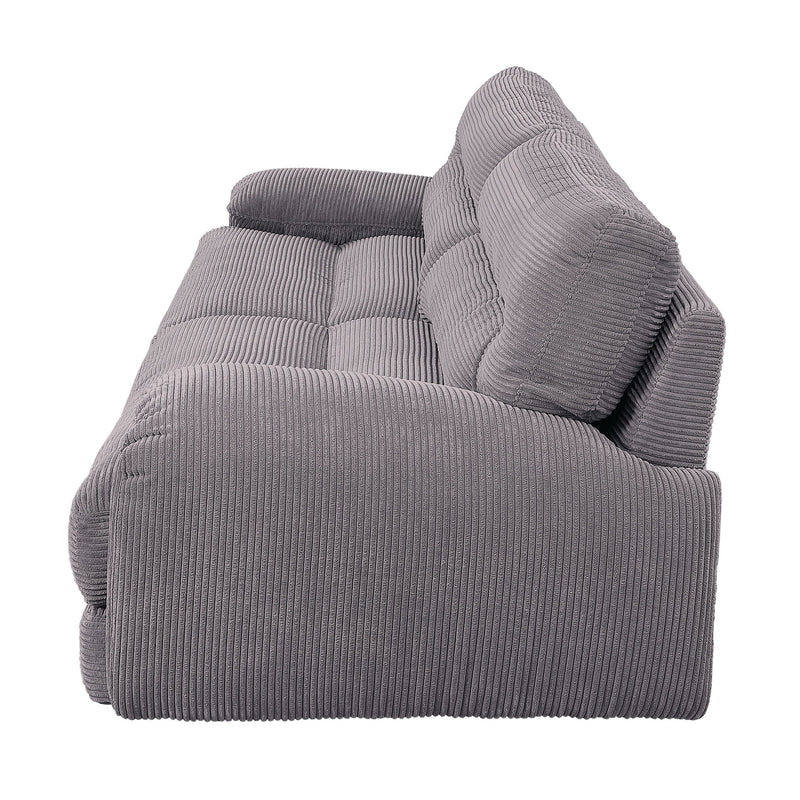 Gray corduroy sofa seat and arm with textured fabric and supportive back cushions