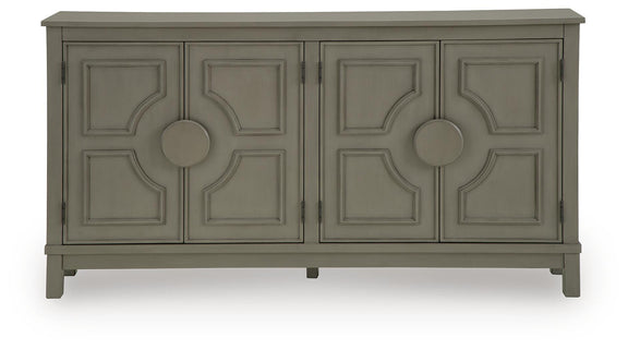 Warm gray accent cabinet with four panel doors and round center knobs, front view