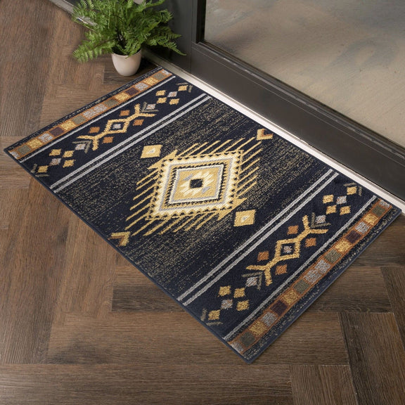 Black southwest area rug with yellow medallion center and geometric stripe border.