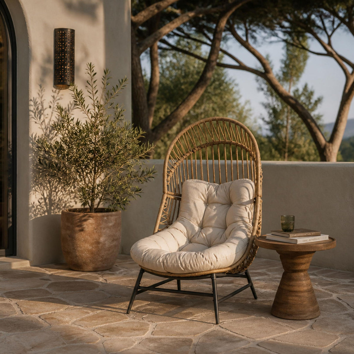Light brown rattan lounge chair with beige cushion on outdoor patio