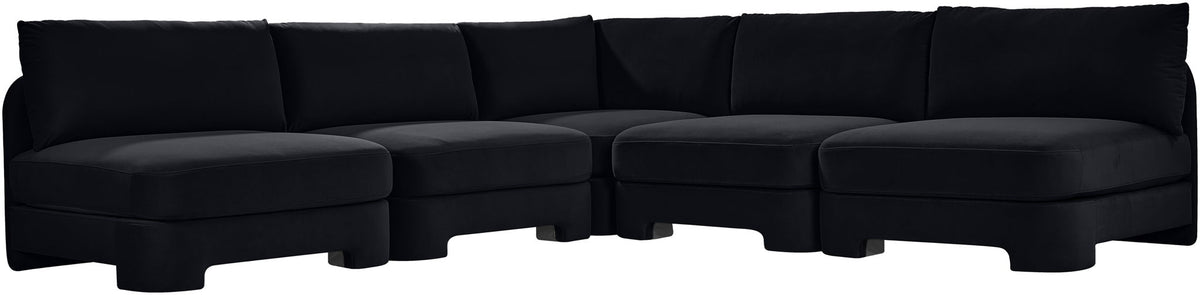Black velvet armless sectional sofa with modular L-shape and padded back cushions