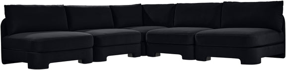 Black velvet armless sectional sofa with modular L-shape and padded back cushions