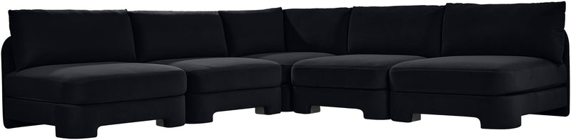 Black velvet armless sectional sofa with modular L-shape and padded back cushions