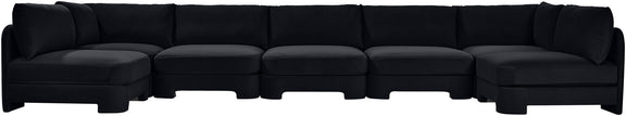 Black velvet U-shaped armless sectional sofa with tufted cushions
