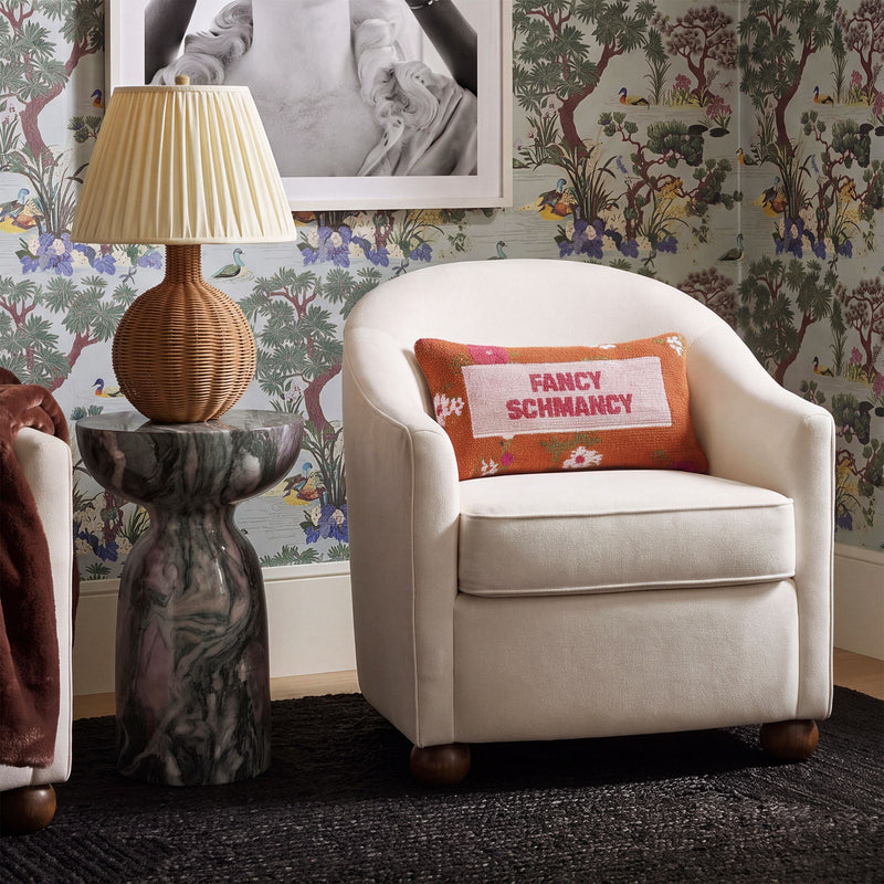 White performance velvet accent chair with upholstered armchair design and patterned text pillow
