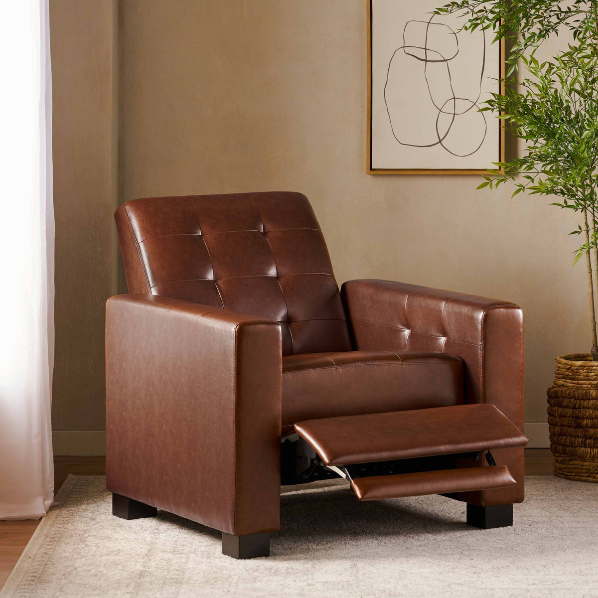 Dark brown tufted recliner with footrest extended from a side angle