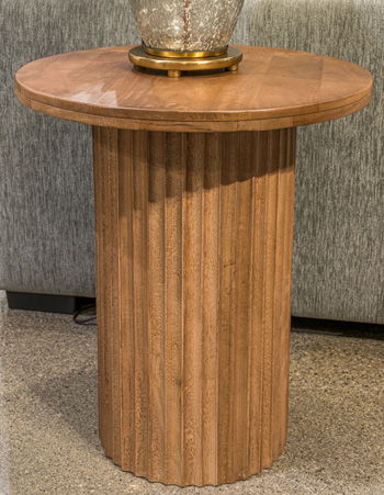 Light brown round wooden side table with fluted pedestal and smooth tabletop