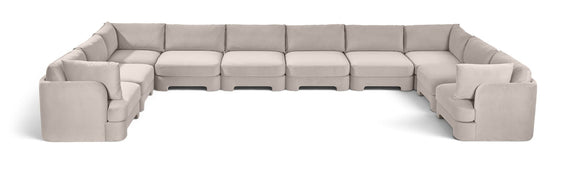 10-piece velvet sectional sofa, light gray modular L-shape with chaise and ottoman-style seats.