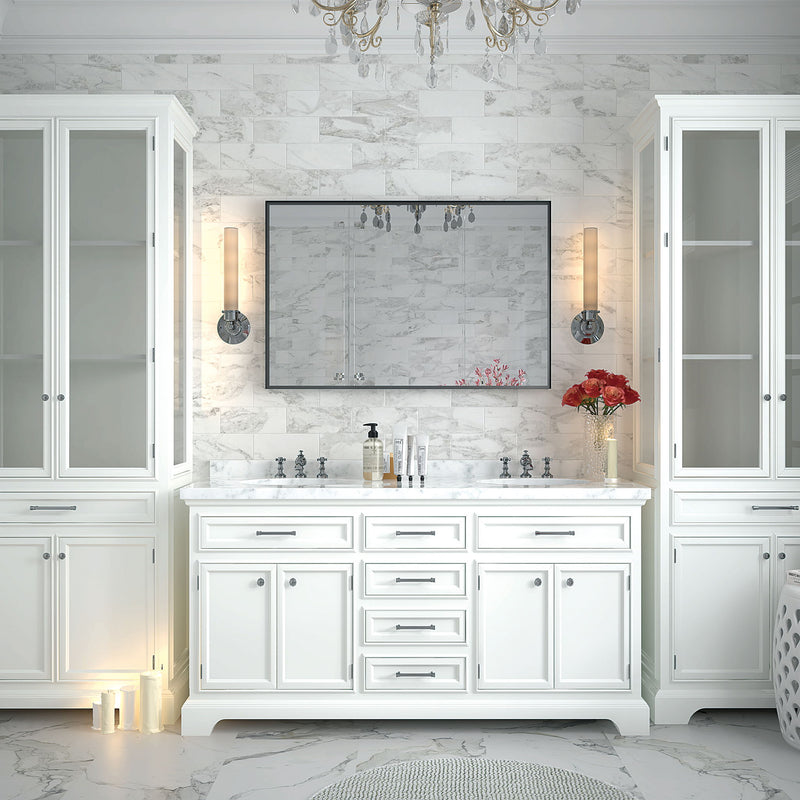Rectangular bathroom mirror with dark frame mounted above vanity cabinets.
