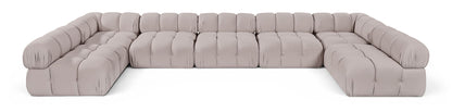 Beige U-shaped modular sectional sofa with cushioned seat and rounded armrests