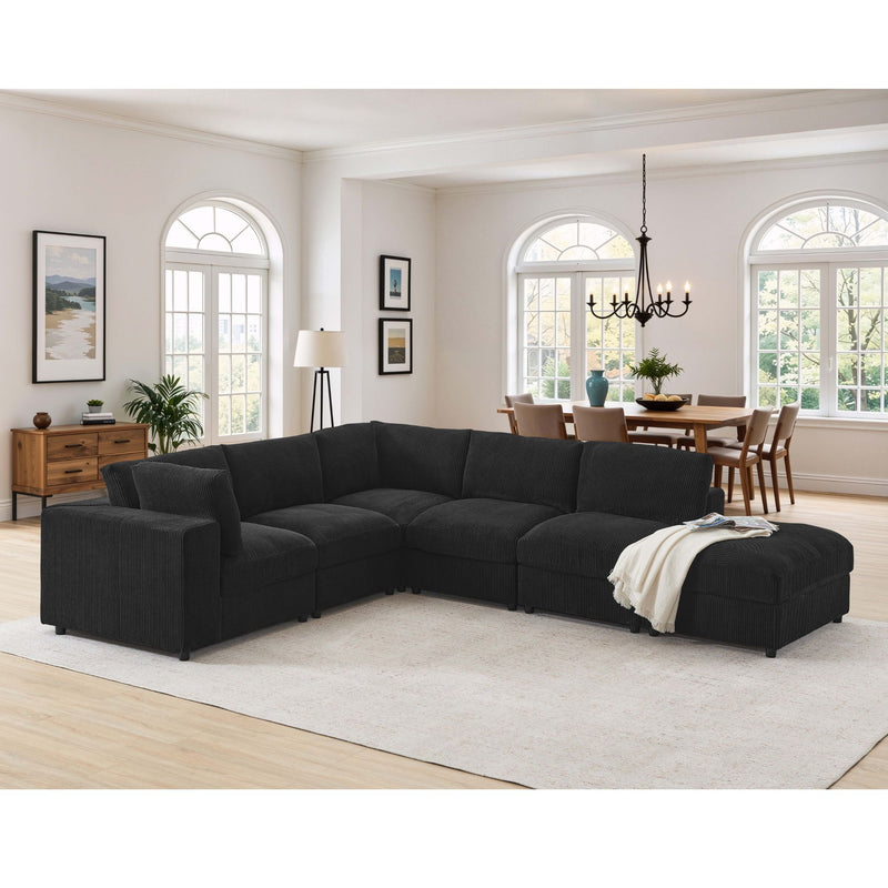 Black modular sectional sofa with chaise and ottoman seats, L-shaped corner design