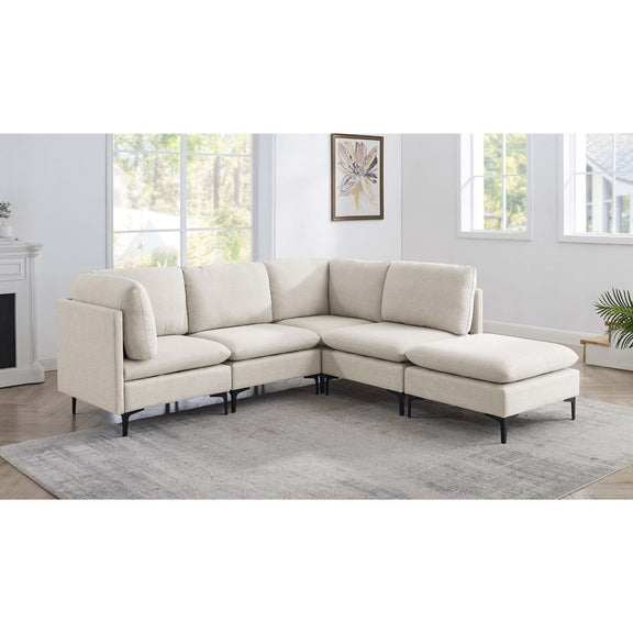 Beige modular sectional sofa with ottoman and tall black legs, padded cushions