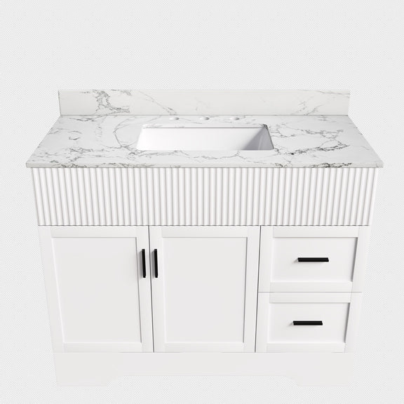White bathroom vanity with fluted cabinet, sink, two doors and two drawers