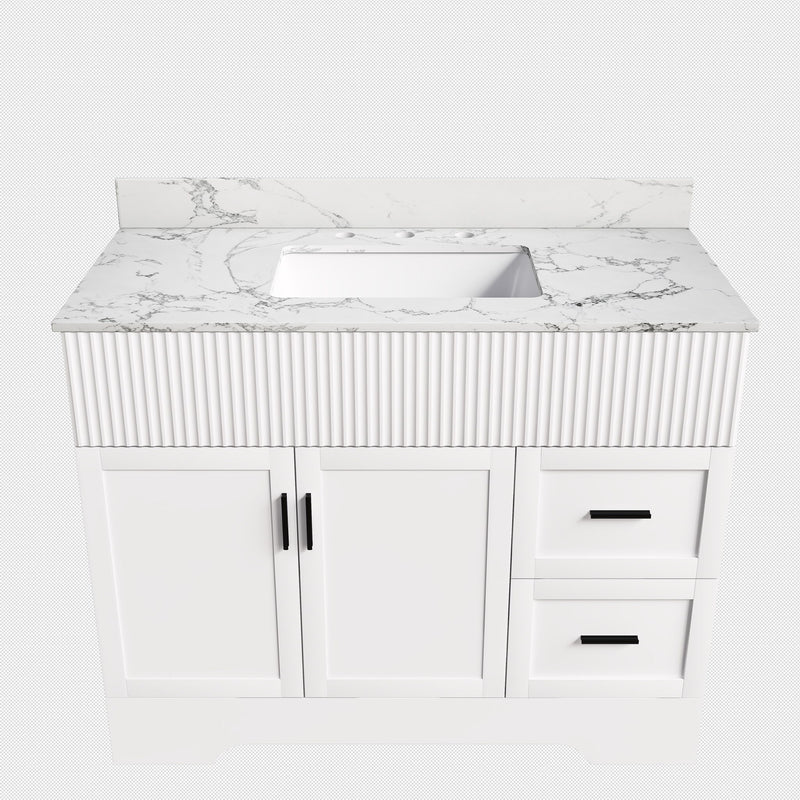 White bathroom vanity with fluted cabinet, sink, two doors and two drawers