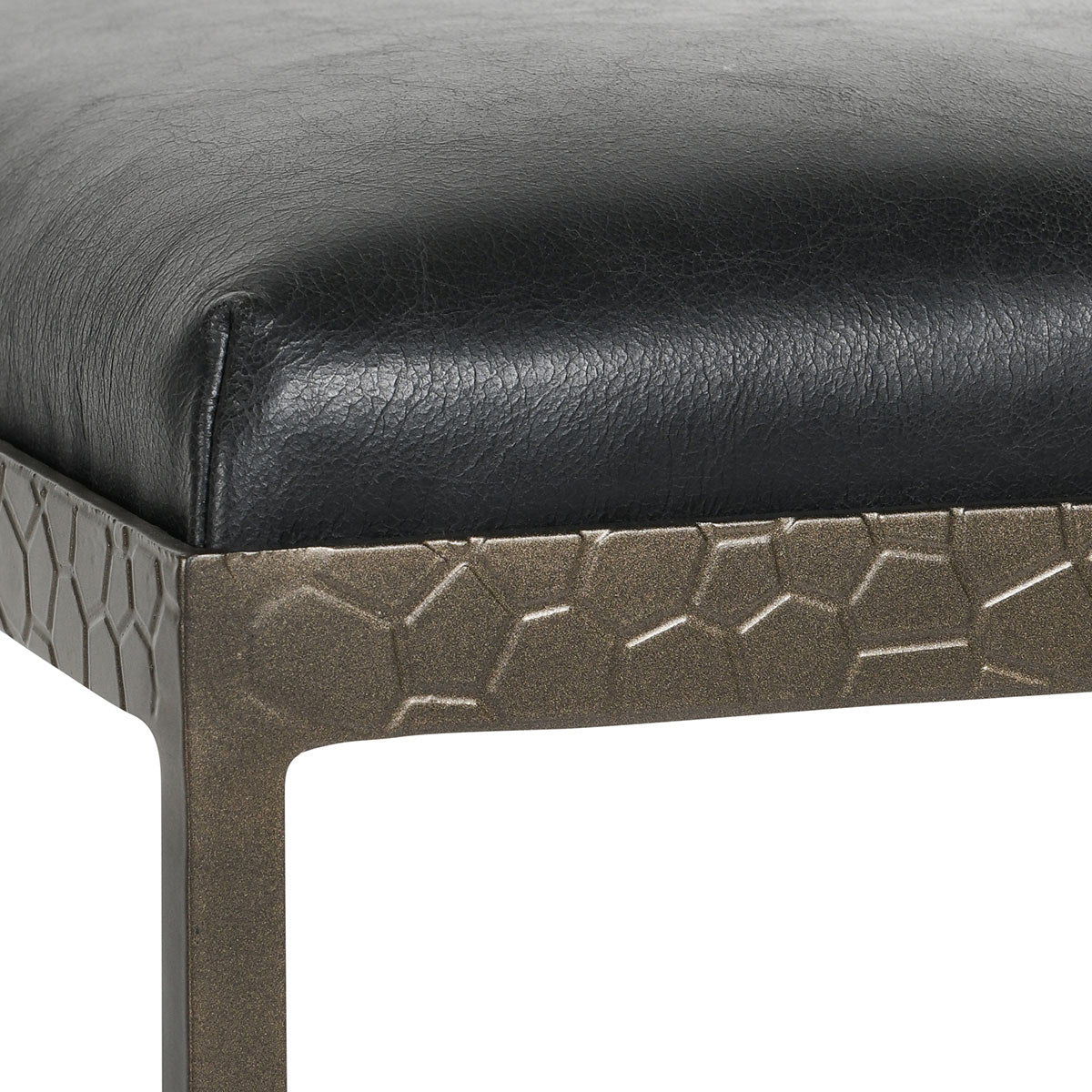 Leather counter stool with black cushioned seat and dark metal base with textured pattern