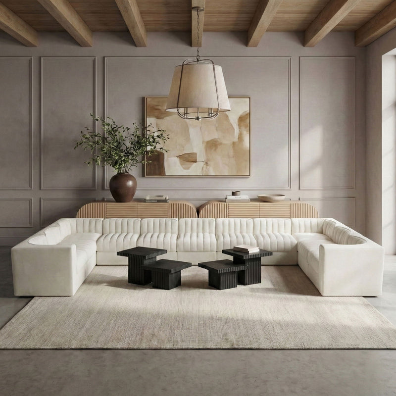 Light beige velvet modular sectional sofa with channel tufting and square arms