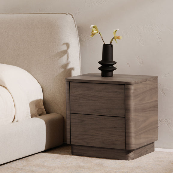 Walnut two-drawer nightstand with smooth top and dark drawer trim line.