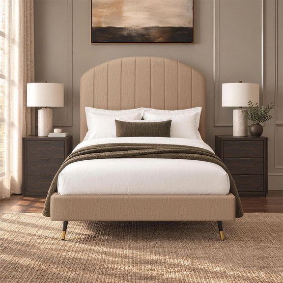 Beige arched channel upholstered bed with padded headboard and footboard